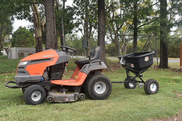 Riding lawn best sale mower spreader